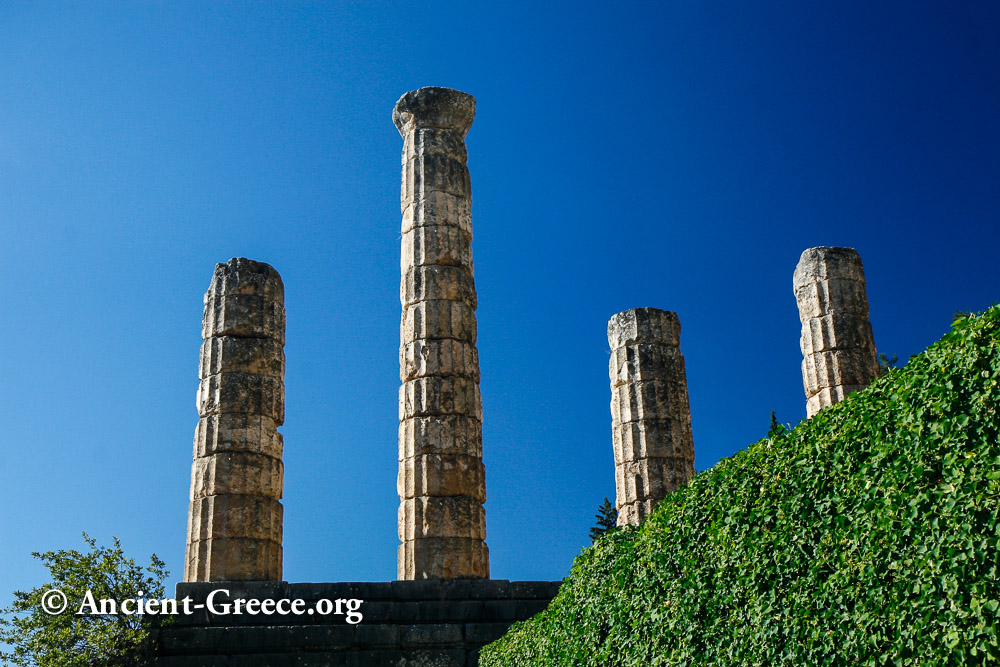 4 ancient column segments against blue sky.