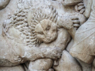 Relief sculpture of a lion biting a warrior from the Siphnian Treasury