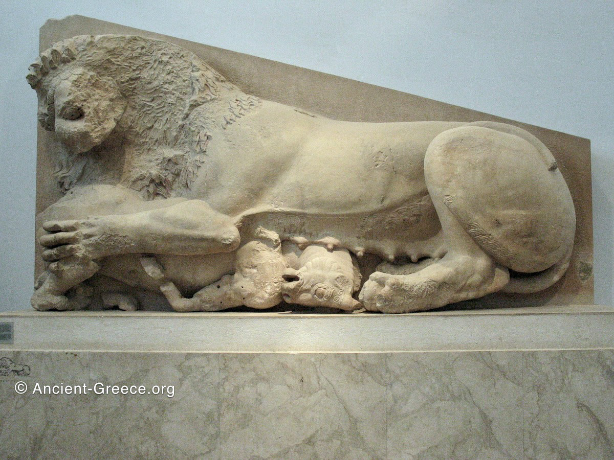 Lioness attacking a cow sculpture