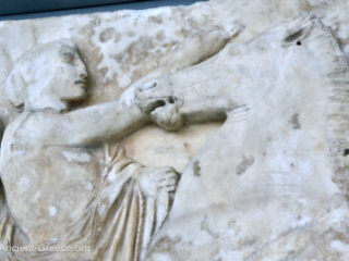 sculpture of man controlling a horse.