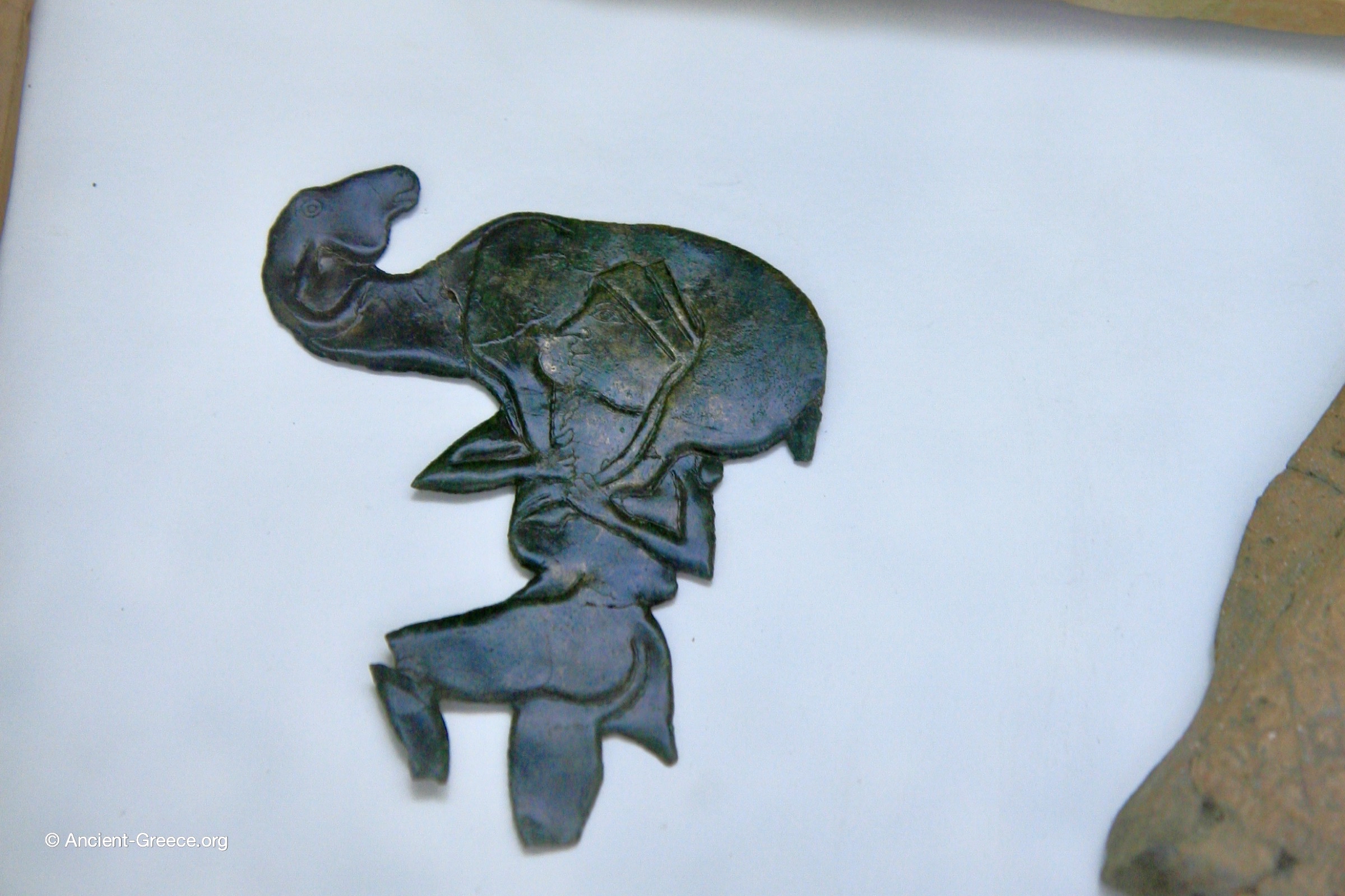 Cutout bronze plaque from the