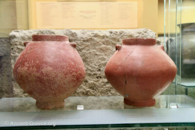 Two burnished conical jars.