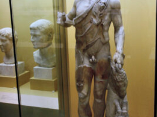 Marble statue of Satyr holding a goat