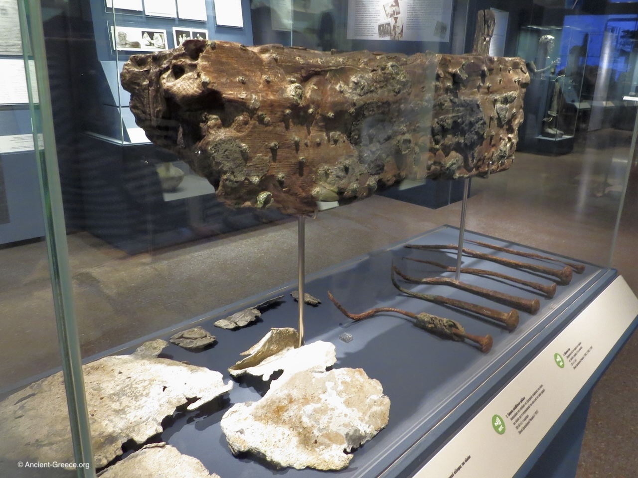 Antikythera Shipwreck: A piece of a plank from the lower part of the ship's hall, sheets of lead, and bronze spikes.