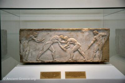 Relief sculpture from a Kouros base depicting a scene with four athletes