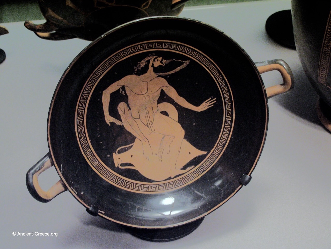 Drinking cup with Satyr.