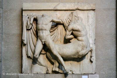 Parthenon metope. A Lapith holds a wounded Centaur from behind.