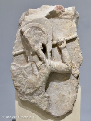 Relief sculpture fragment depicting a hoplite in battle