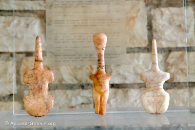 Three Cycladic statuettes