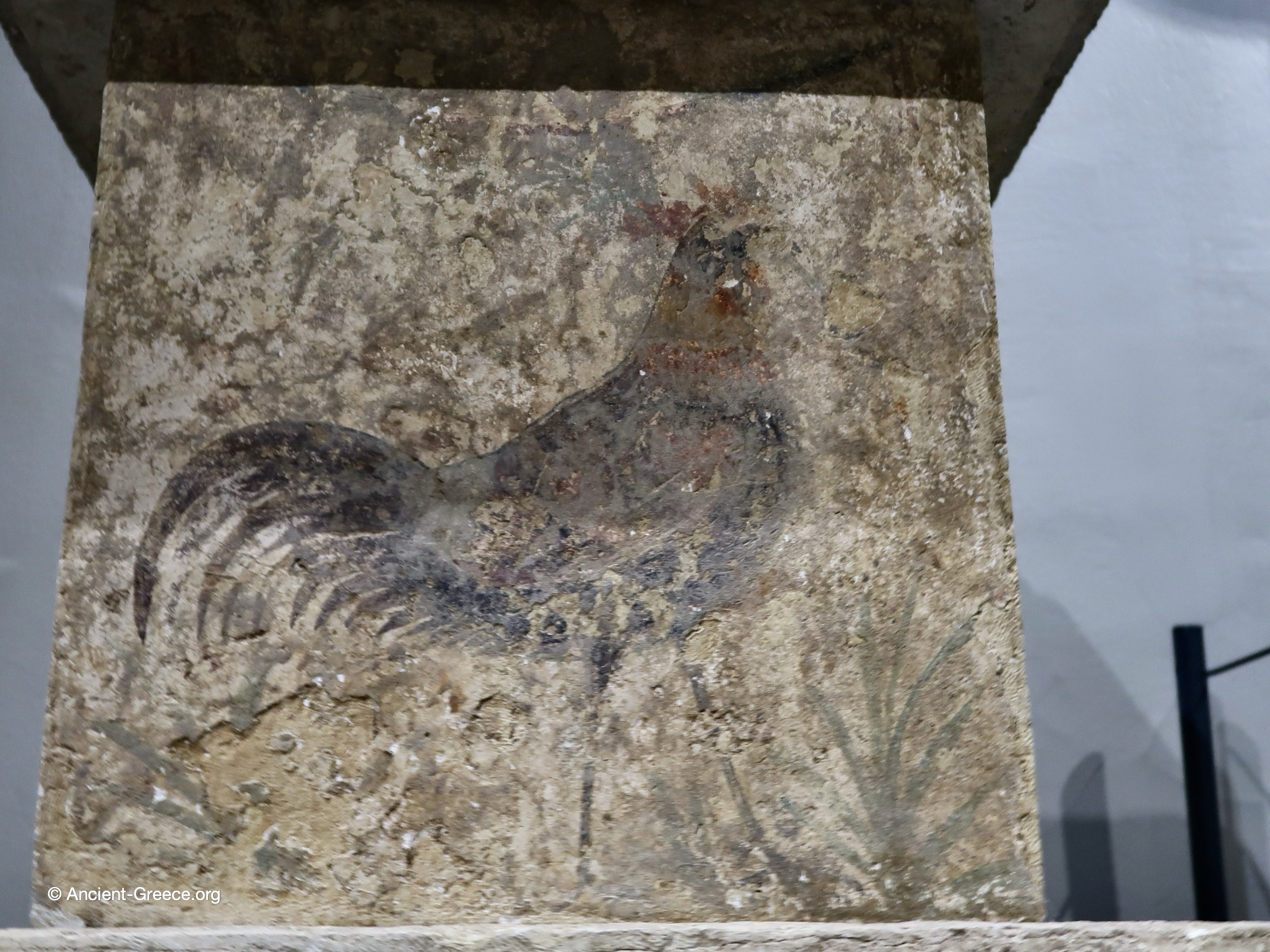 Closeup of the rooster painting on the altar