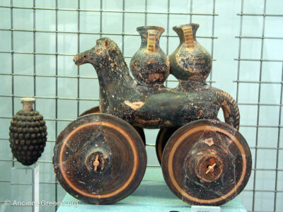 Clay horse with wheels and jugs