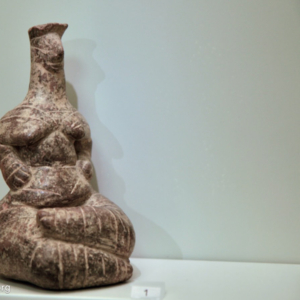 Clay seated female figurine