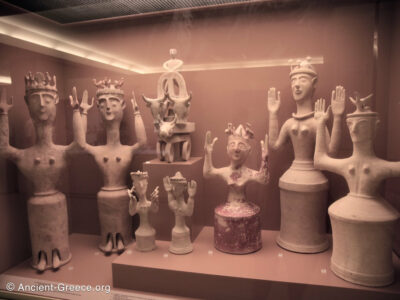 Clay figures of goddess with upraised arms