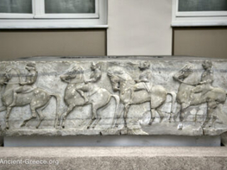Horsemen procession relief sculpture