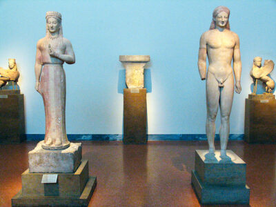 Two marble statues of a Kore and a Kouros