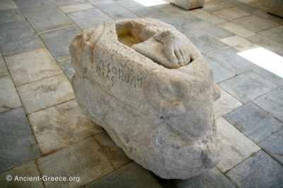 Kouros statue base with Ancient Greek inscription