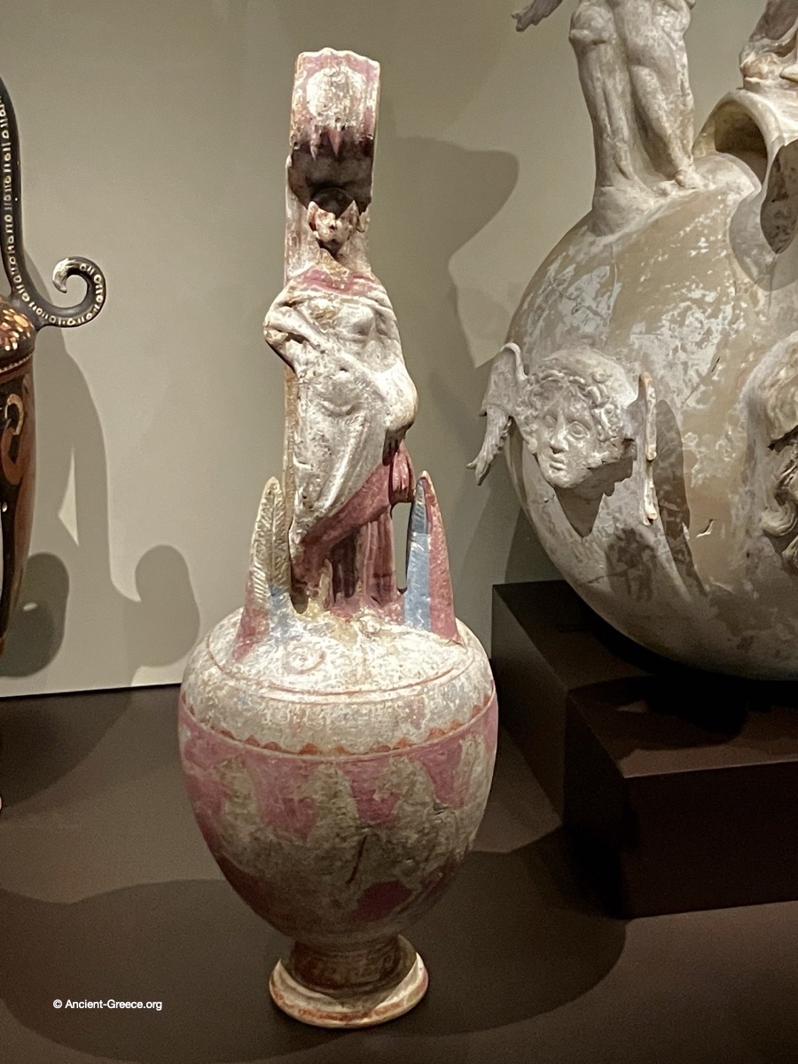 pottery jar with statuette