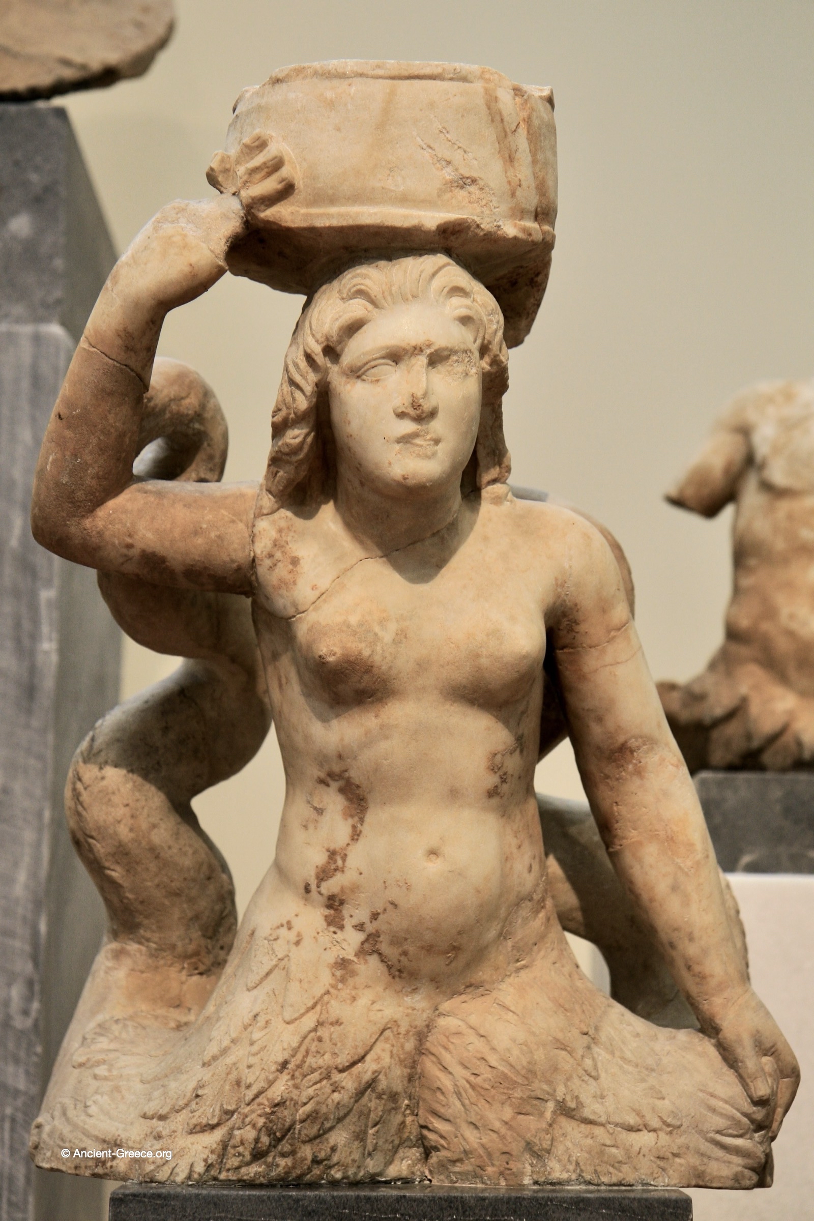 Ancient Greek art on exhibit in the National Archaeological Museum in Athens, Greece. statues of Tritonesses