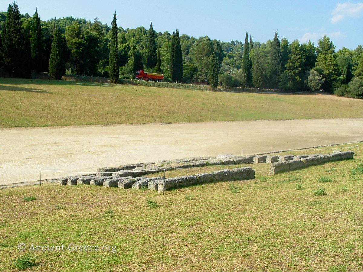 The stone seats of the judges in the middle of the ancient Olympic stadium at Olympia