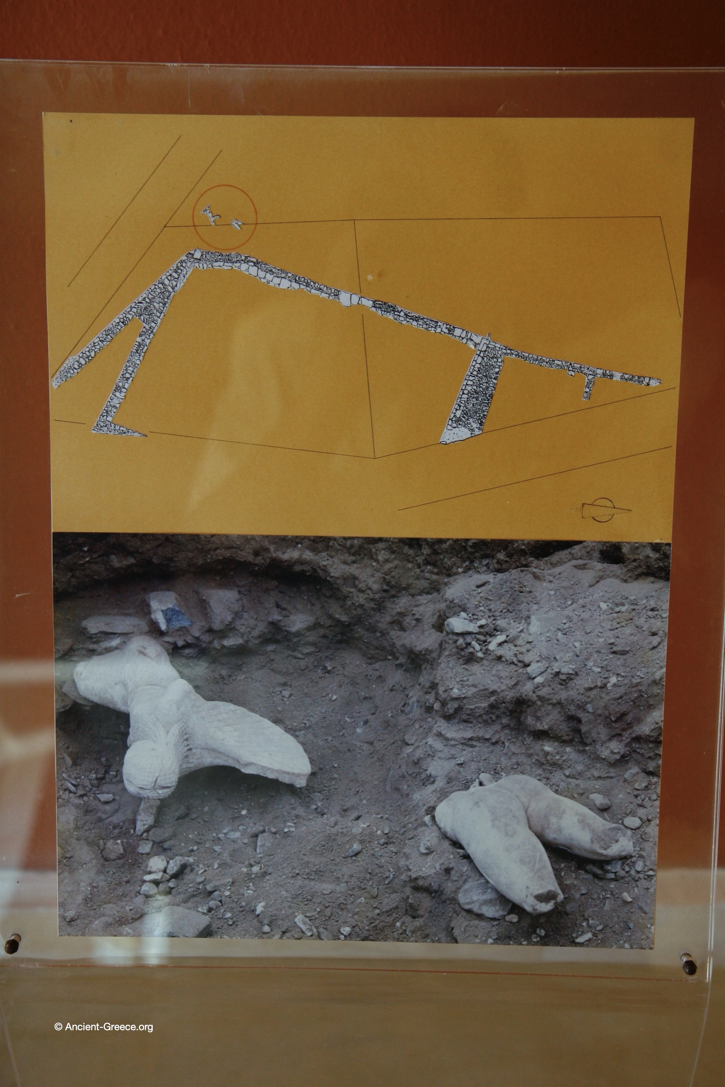 Photo of the excavations with the  statue of a Gorgon