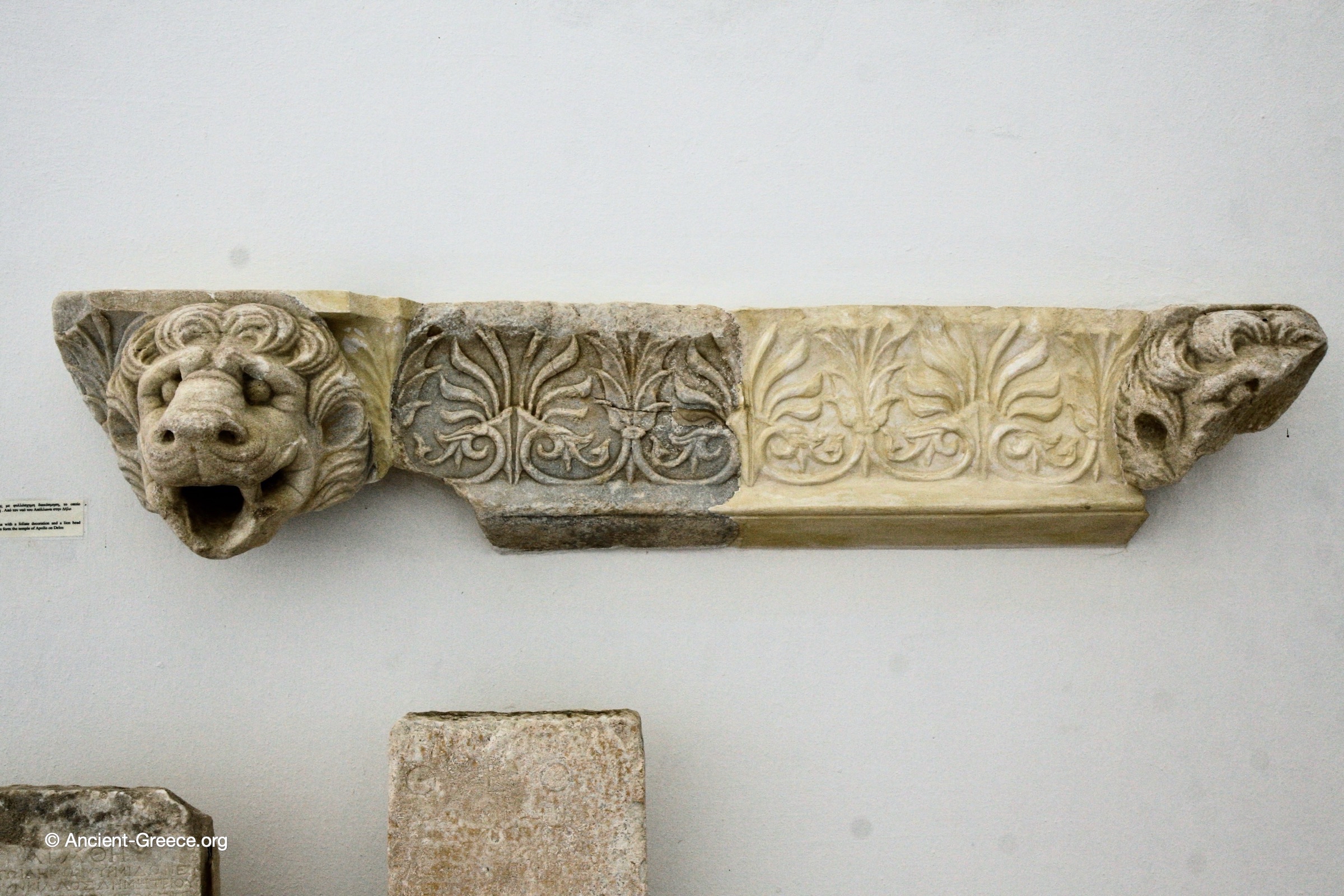 Section detail of a marble cyma with a foliate decoration and a lion head serving as a spout