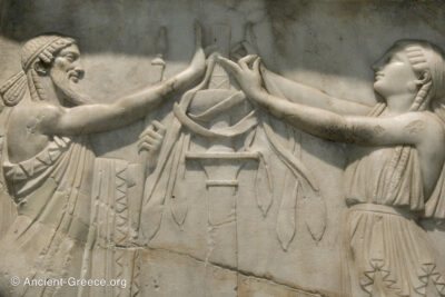 Relief detail of a priest and a priestess performing a ritual.