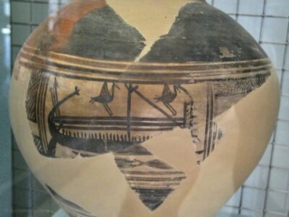 Vase fragment painted with ancient boat and birds.