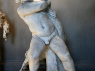 Sculpture of a boy fighting with a goose